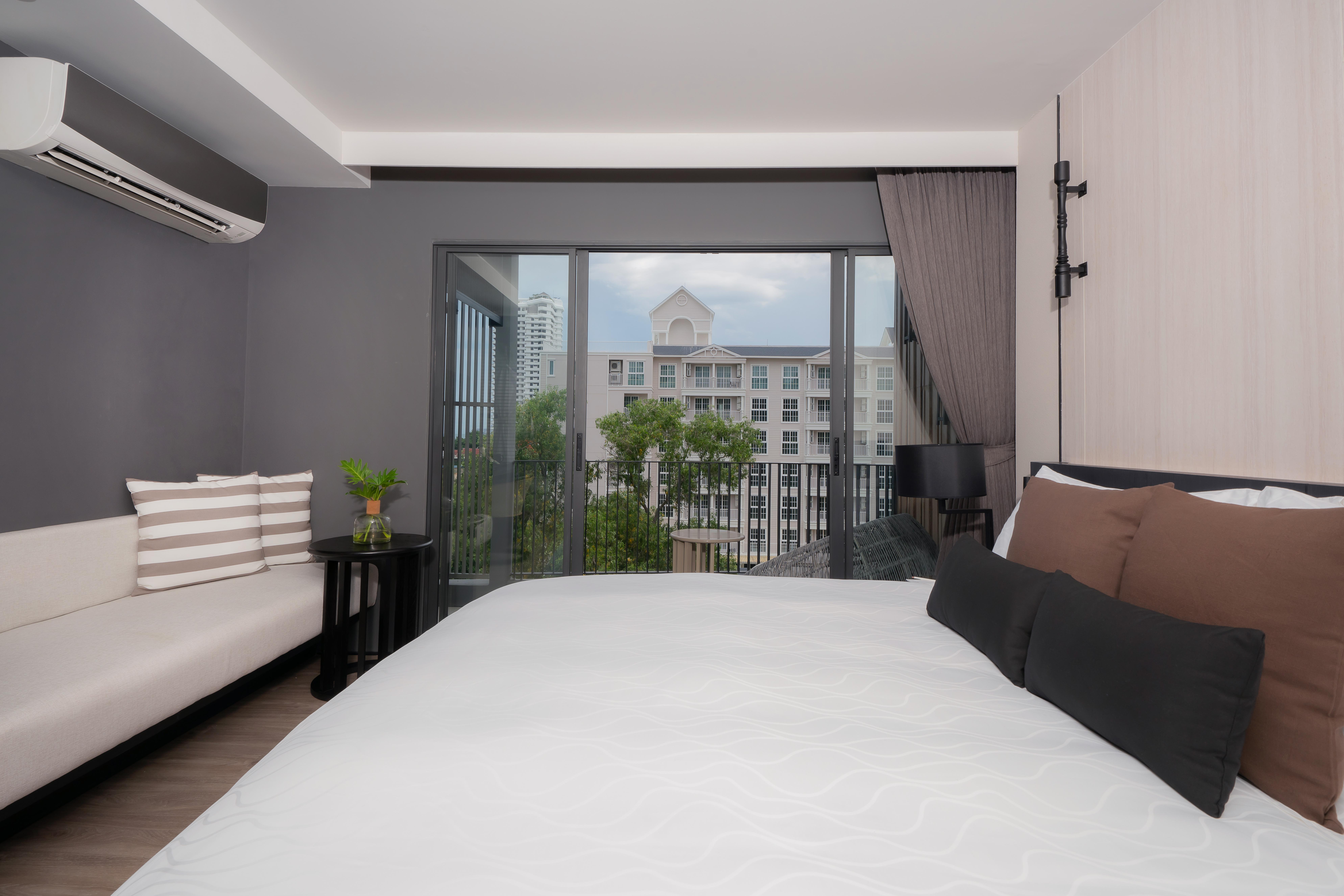 Bayphere Hotel Pattaya Jc Na Chom Thian Buitenkant foto A bedroom at the hotel